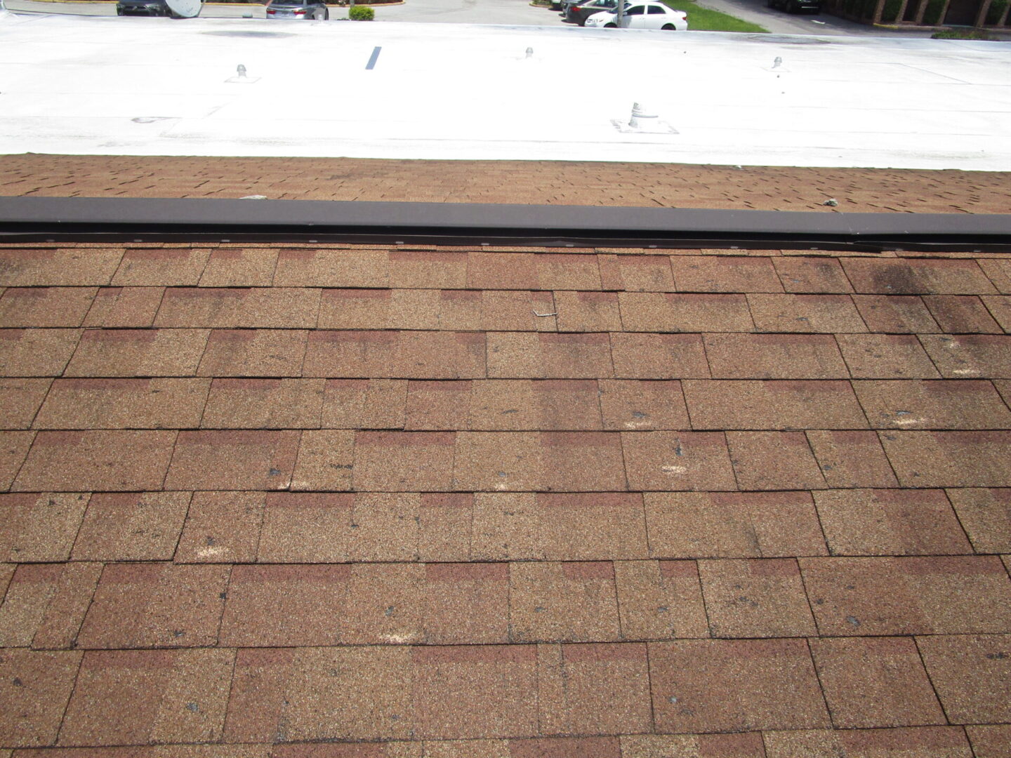 A picture of a roofing work on a house